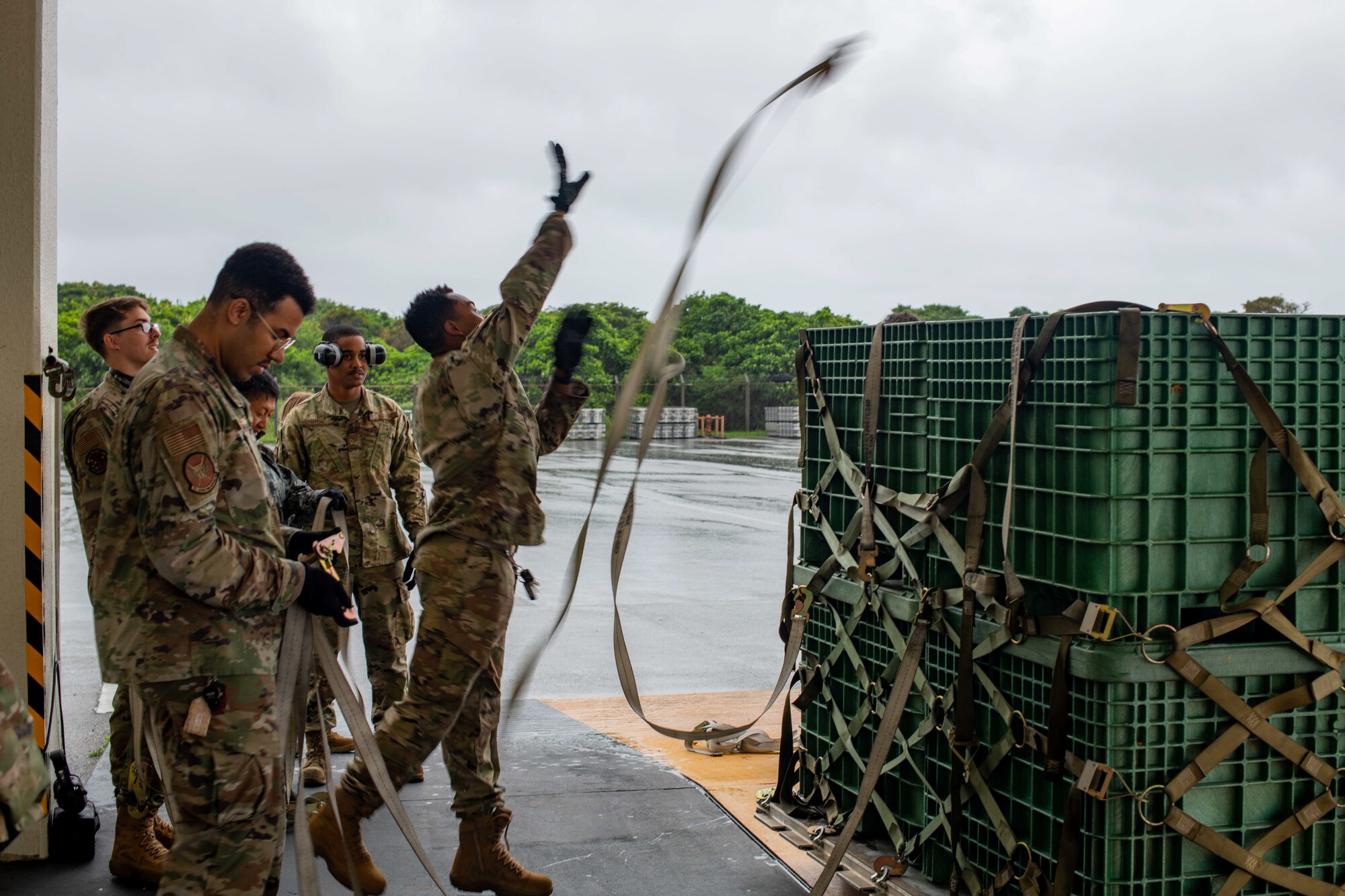 Airmen practice preparing cargo.