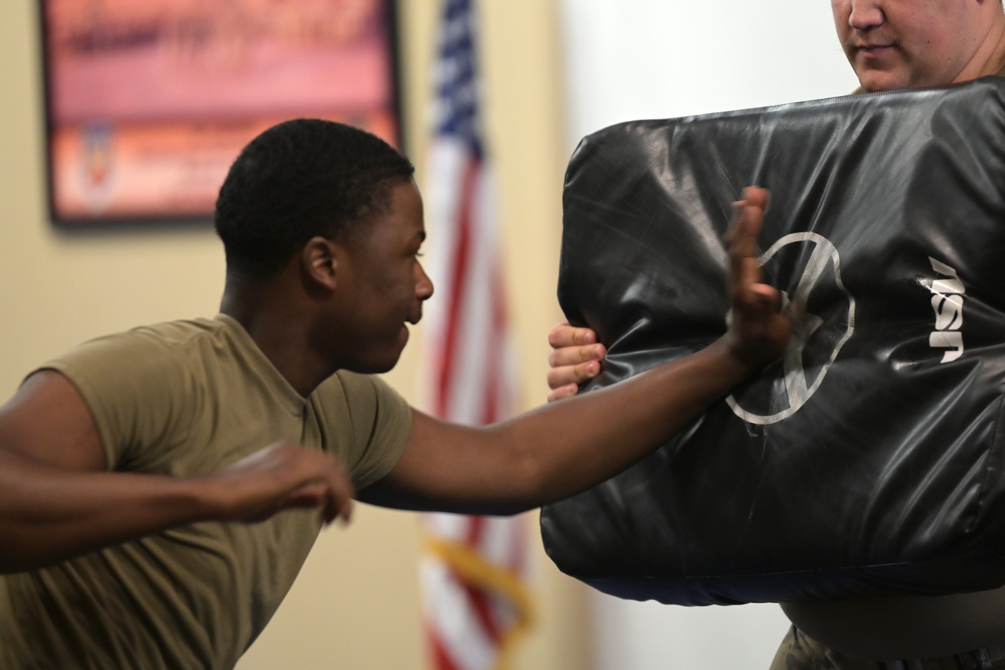 U.S. Air Force Airman 1st Class Michael Jones, 23rd Security Forces squadron installation entry controller, palm-strikes a pad during the first iteration of Krav Maga training at Moody Air Force Base, Georgia, April 13, 2022. Adding new skills to these defenders’ toolbelts will continue developing security forces in more than just the combative aspect. (U.S. Air Force photo by Senior Airman Rebeckah Medeiros)