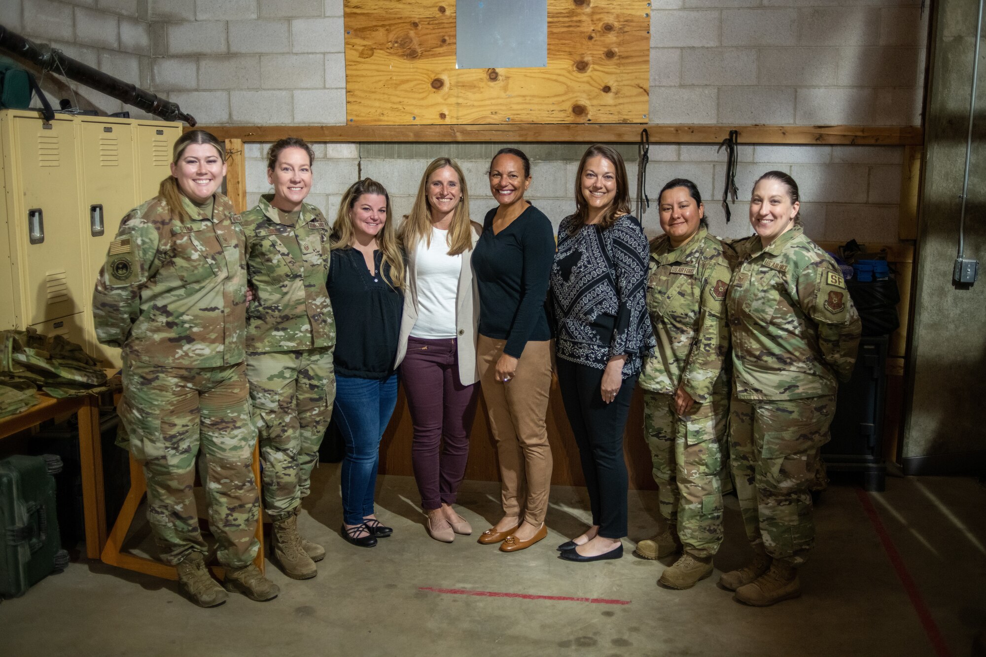 Marsha Cotton, spouse of Gen. Anthony Cotton, Air Force Global Strike Command commander, stands with Sarah Sheffield, spouse of Col. Sheffield, the 28th Bomb Wing commander, and the women of the 28th Security Forces Squadron at Ellsworth Air Force Base, S.D., May 25, 2022.