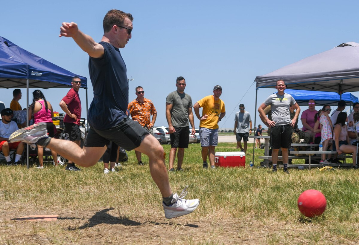 Capt. Stephen Jackson, 433rd Medical Squadron critical care nurse, runs to kick a ball during the Alamo Rising 6 annual kickball tournament at Joint Base San Antonio-Lackland, Texas, May 15, 2022. The kickball tournament was one of several activities at Family Day. (U.S. Air Force photo by Airman 1st Class Mark Colmenares)