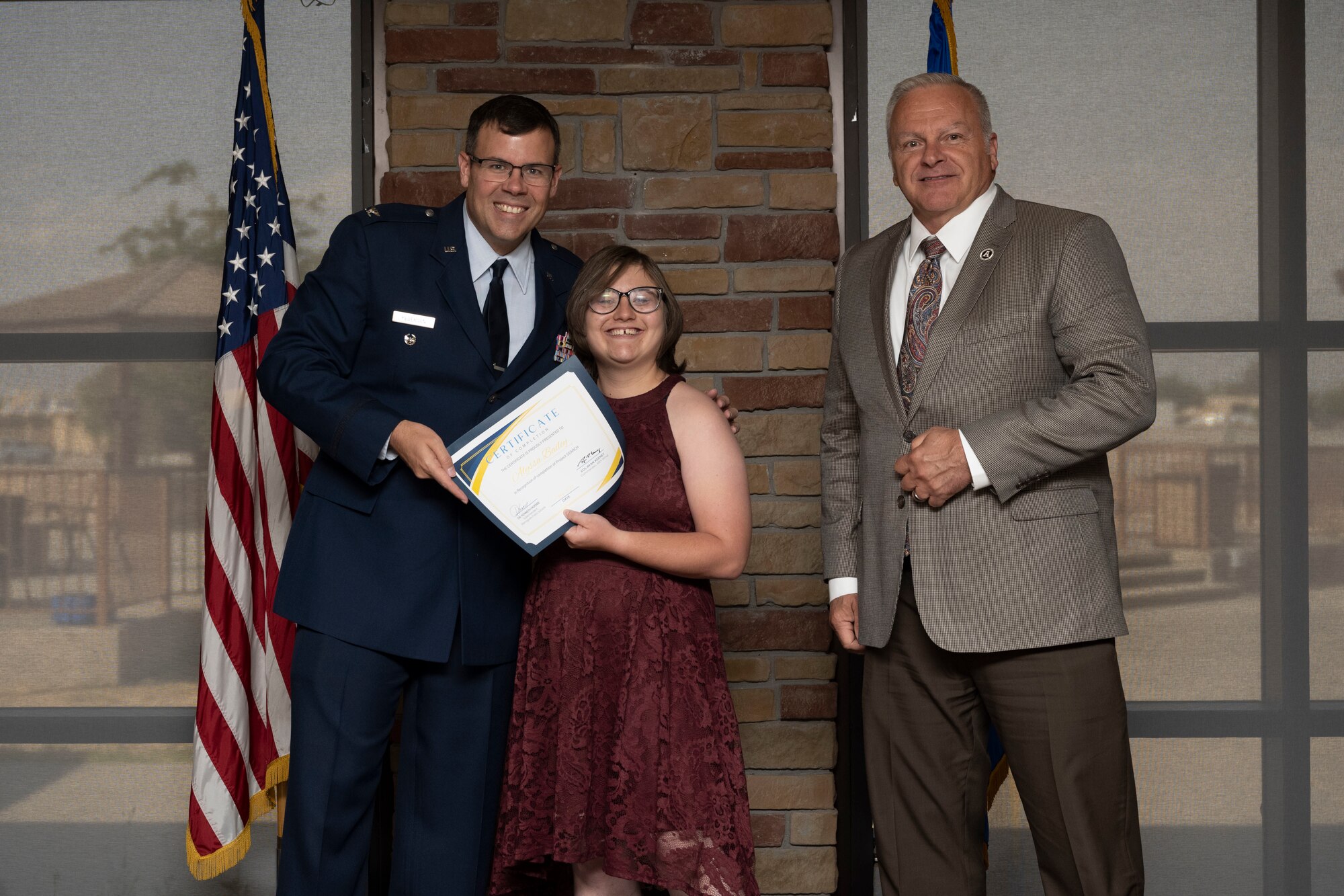 Alyssa Bailey, Project SEARCH intern, receives graduation certificate, May 24, 2022, on Holloman Air Force Base, New Mexico.