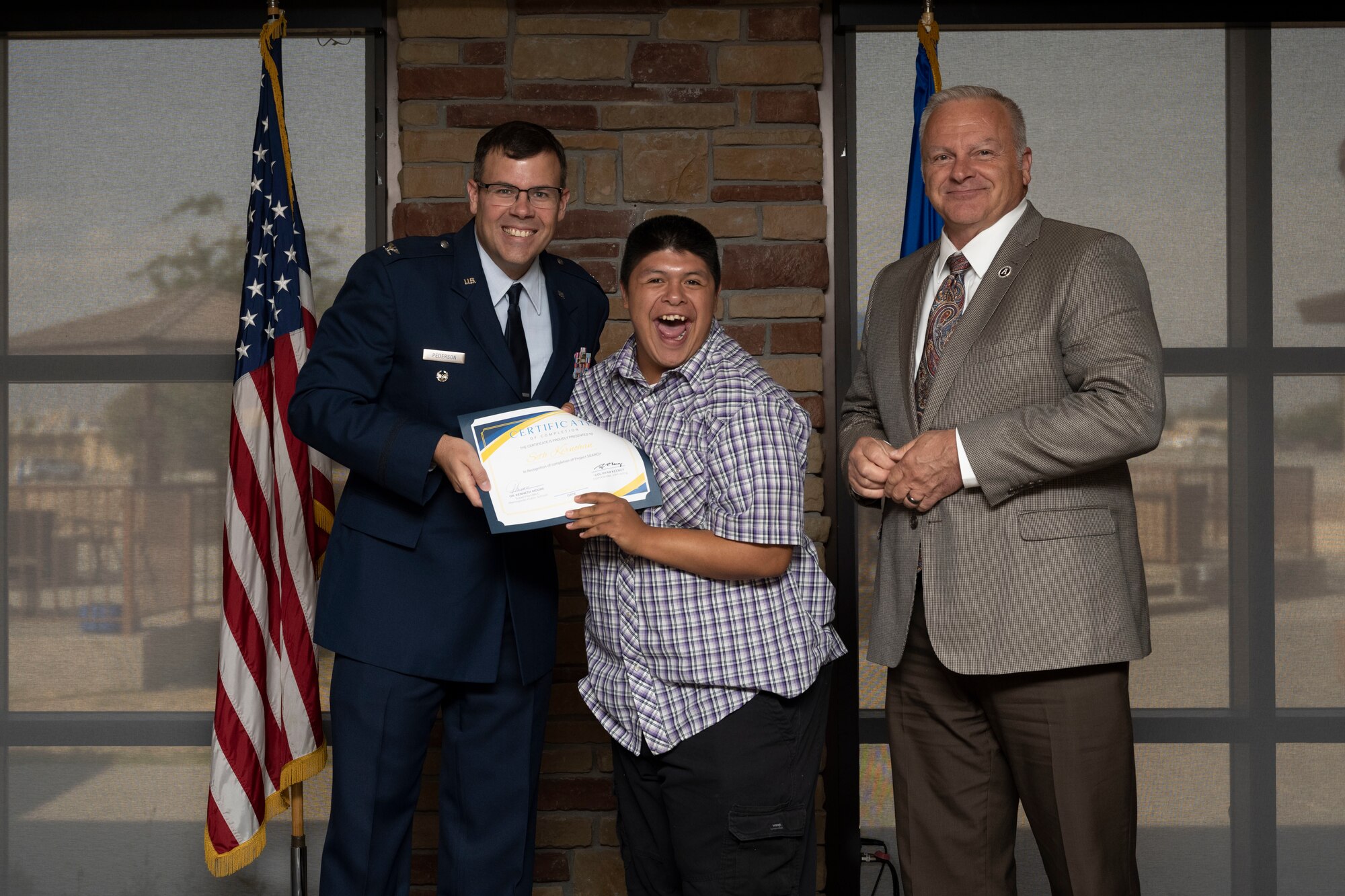 Seth Kernohan, Project SEARCH intern, receives graduation certificate, May 24, 2022, on Holloman Air Force Base, New Mexico.