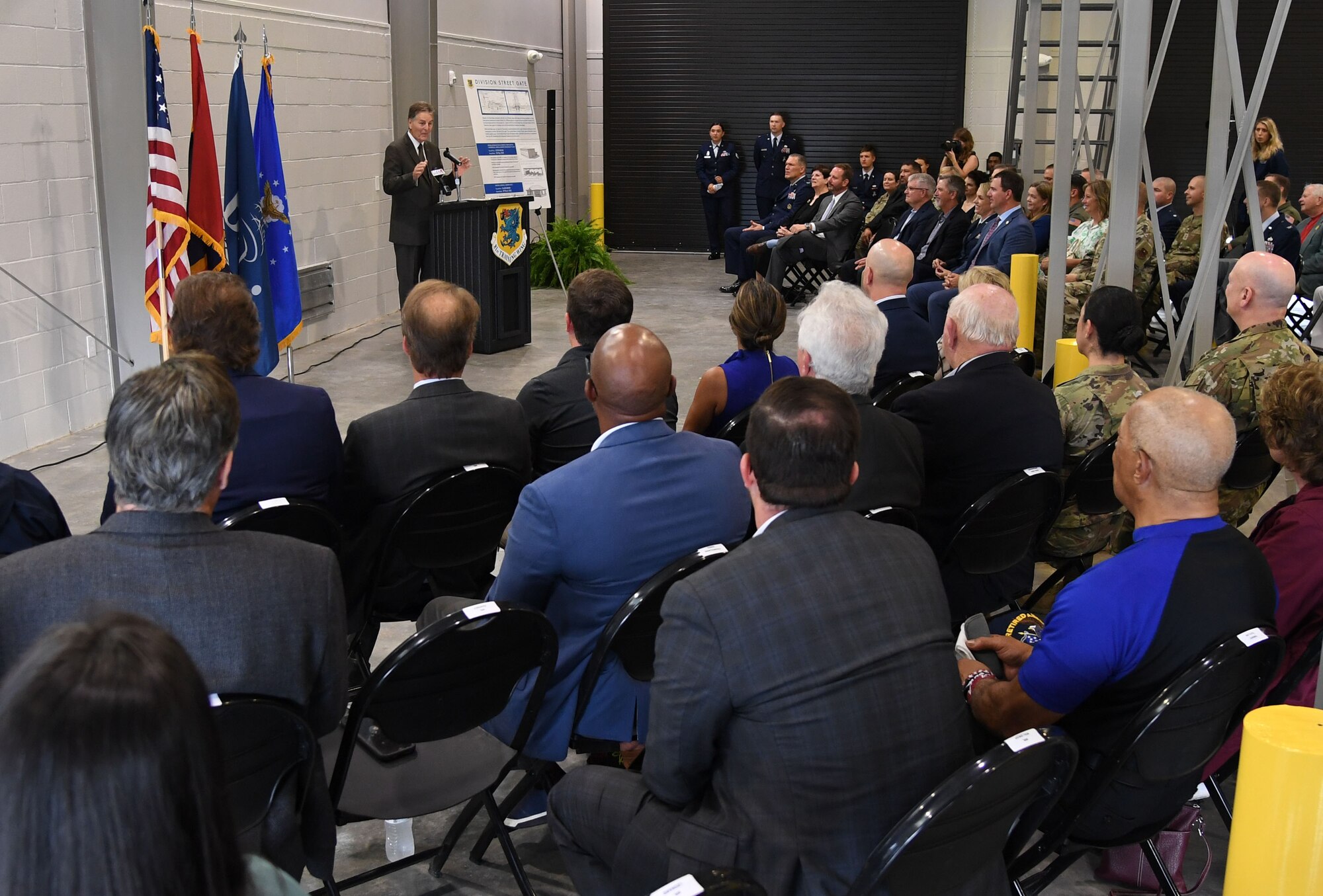 Mayor Andrew "FoFo" Gilich, Biloxi, Mississippi mayor, delivers remarks during the Division Street Gate Ribbon Cutting Ceremony inside the Commercial Vehicle Inspection Building at Keesler Air Force Base, Mississippi, May 26, 2022. After approximately two years of construction, Keesler's new main gate marks the completion of a multi-sourced and multi-funded project which will enhance force protection and anti-terrorism measures. Keesler partnered with the city of Biloxi, along with state and federal planners, to align the primary entrance at Division Street. (U.S. Air Force photo by Kemberly Groue)