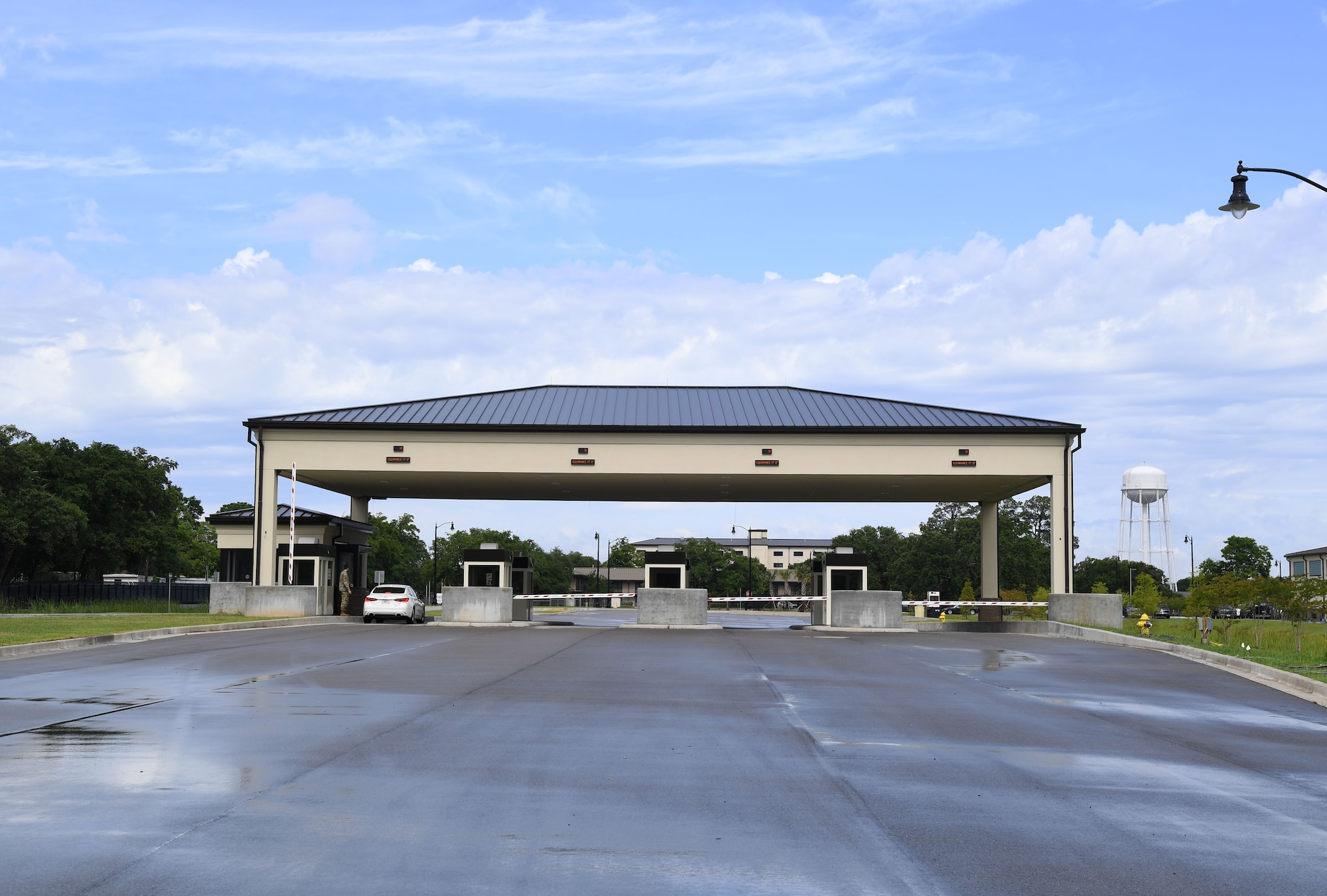 The main gate compound is showcased during the Division Street Gate Ribbon Cutting Ceremony at Keesler Air Force Base, Mississippi, May 26, 2022. After approximately two years of construction, Keesler's new main gate marks the completion of a multi-sourced and multi-funded project which will enhance force protection and anti-terrorism measures. Keesler partnered with the city of Biloxi, along with state and federal planners, to align the primary entrance at Division Street. (U.S. Air Force photo by Kemberly Groue)