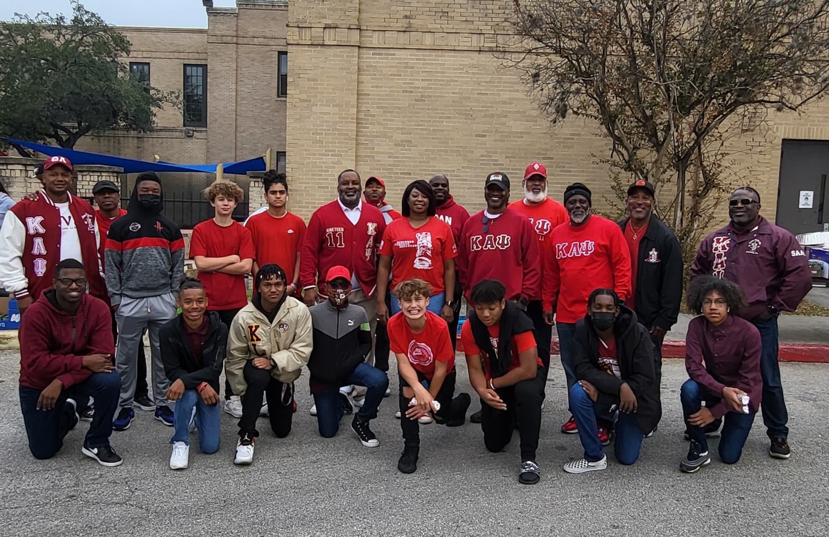 Group photo of Kappa League volunteers and youth in the program