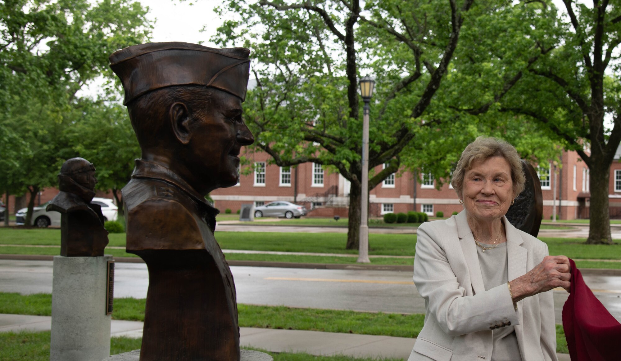 woman unveils  statue