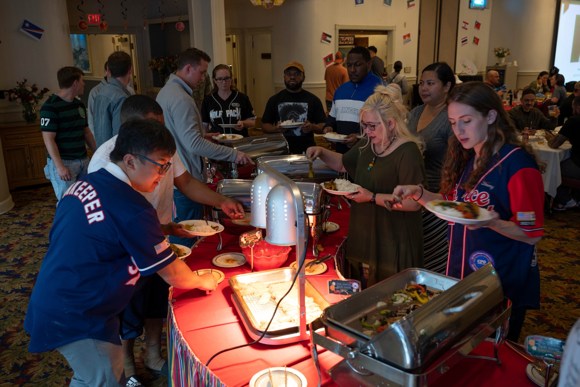 Residents of Kunsan Air Base fill their plates with food.