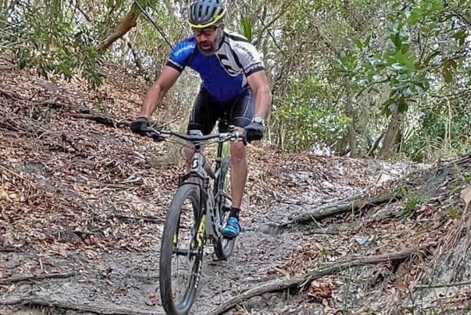 A man rides a mountain bike on a trail.