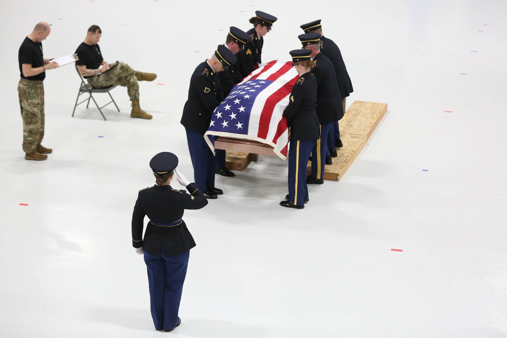 Soldiers and a flag covered coffin