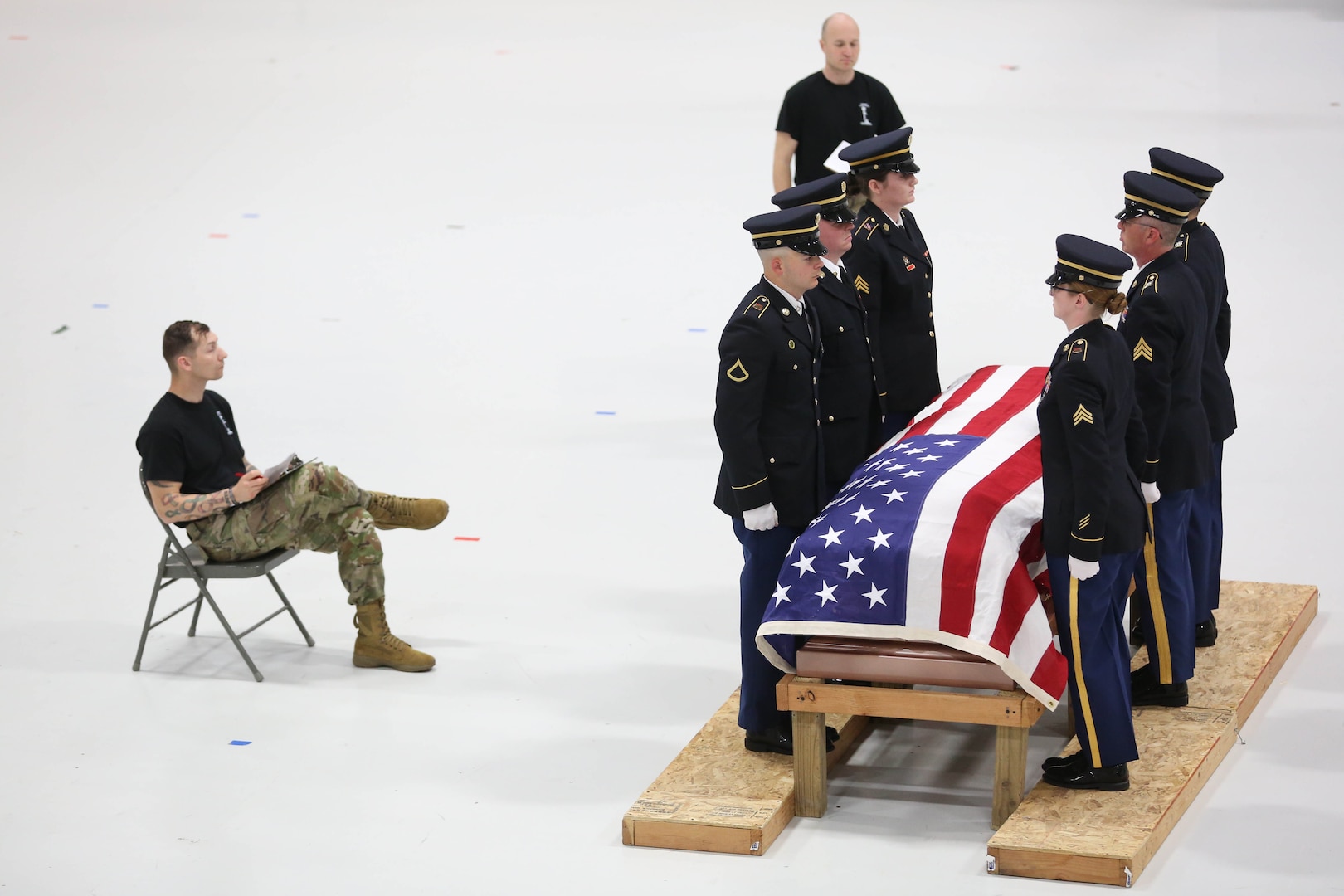 Soldiers and a flag covered coffin