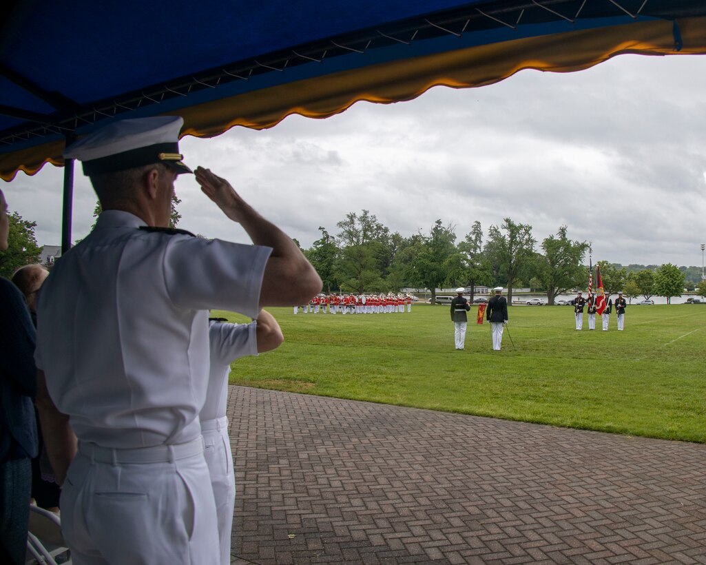 Marines with the Official U.S. Marine Corps Color Guard present the U.S. flag during a performance at the Naval Academy Commissioning Week in Annapolis, Md., May 24, 2022.