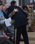Brig. Gen. David Manfredi, director of joint staff for the Vermont National Guard, hugs his daughter, Capt. Hailey Manfredi, after giving her flowers during his retirement ceremony May 26, 2022, at Camp Johnson, Vermont. General Manfredi retired May 26 after more than 30 years of service, including assignments as commander of the 124th Regiment (Regional Training Institute) and commander of the 3-172nd Infantry (Mountain). He deployed to Afghanistan twice in support of Operation Enduring Freedom. (U.S. Army National Guard photo by 1st Lt. Nathan Rivard)