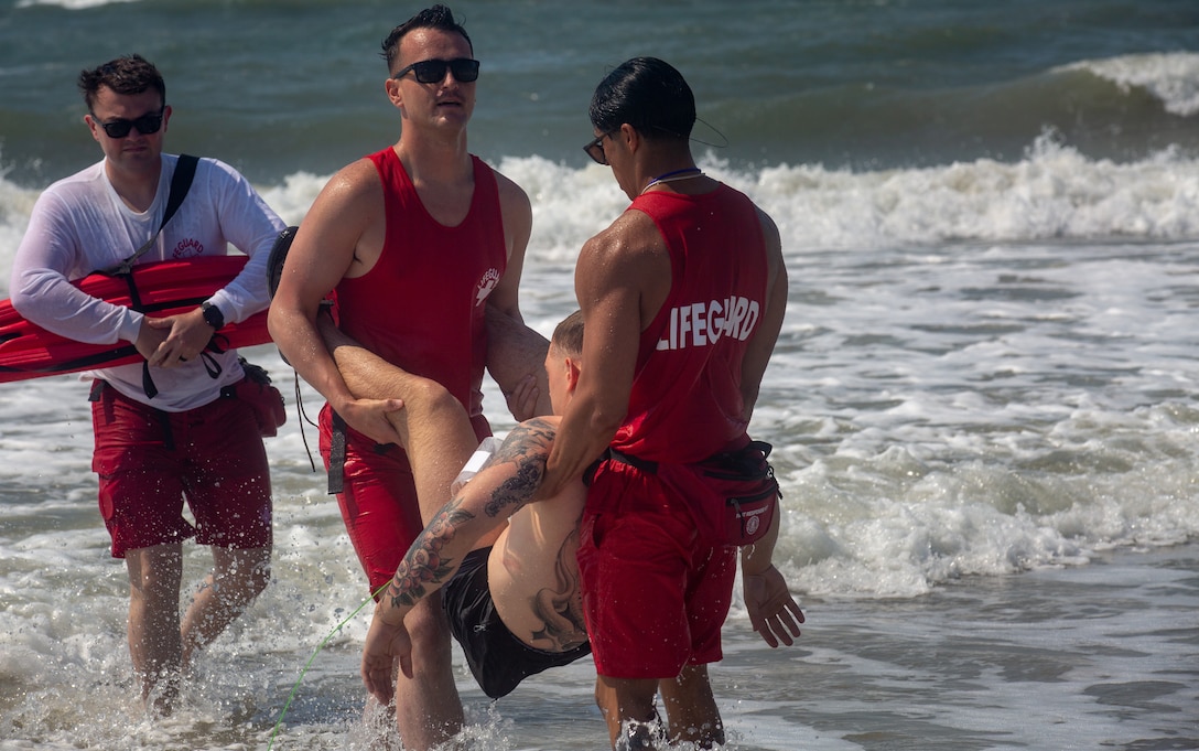 U.S. Marines with Headquarters and Support Battalion, Marine Corps Installations East-Marine Corps Base (MCB) Camp Lejeune, conducted a simulated response training exercise at Onslow Beach on MCB Camp Lejeune, North Carolina, May 19, 2022. Each year the Beach Detachment conducts a training exercise to familiarize first responders, and other individuals, with the expectations of response in case of an emergency. (U.S. Marine Corps photo by Lance Cpl. Khalil Brown)