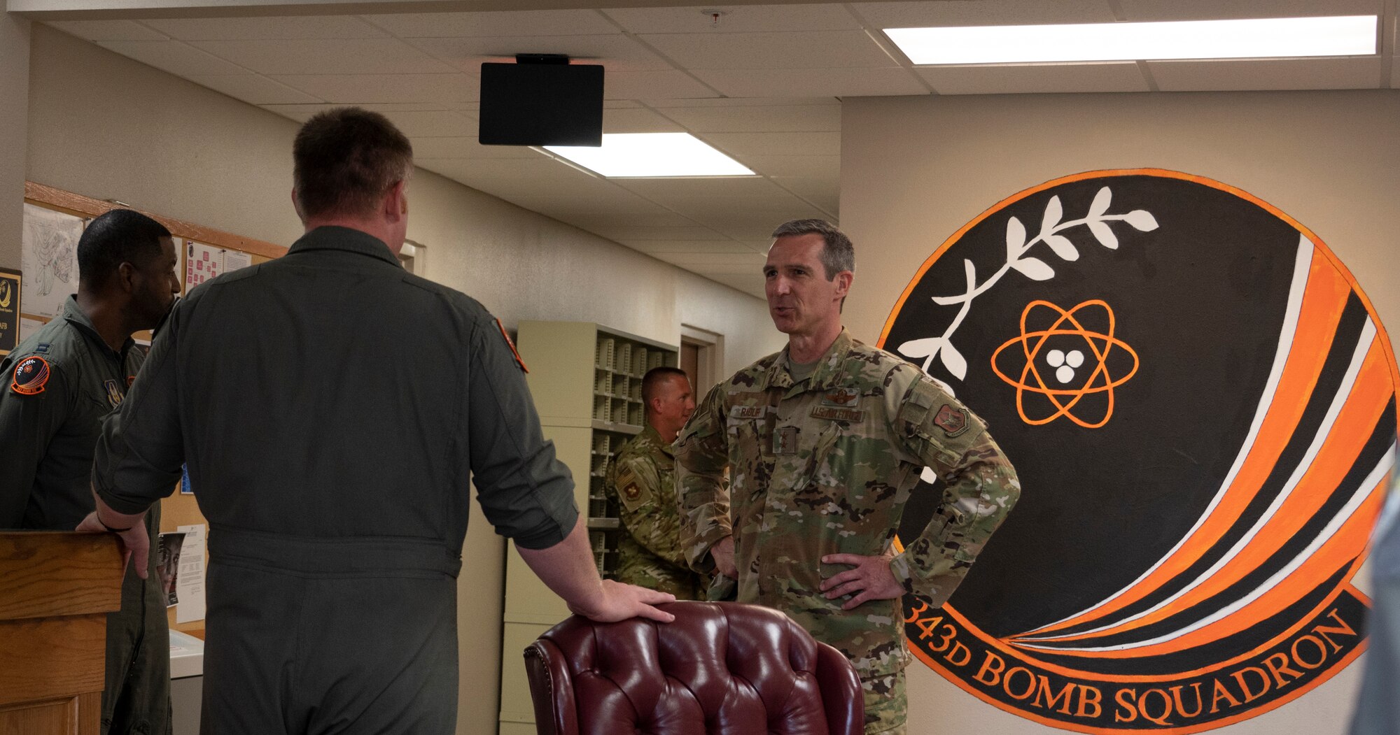 Photo of two Airmen talking