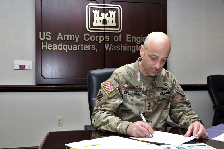 Lt. Gen. Scott A. Spellmon, Chief of Engineers and U.S. Army Corps of Engineers Commanding General, signs a Chief’s Report for the Tacoma Harbor Navigation Improvement Project at headquarters in Washington D.C., May 26, 2022. (U.S. Army photo by Philipp Tintner)