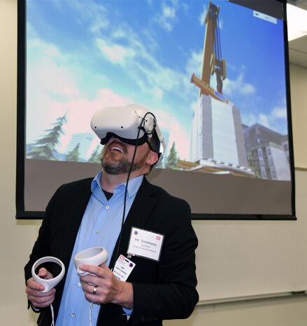 Kenneth SImmons, USACE chief of construction, tries out a demo of a new training program being created by the Army Game Studio and Huntsville Center's Safety Office. The program, scheduled to be completed this fall, uses gaming technology to allow users to virtually explore a construction site and test themselves on hazard identification and safety measures. (Photo by Kristen Bergeson)