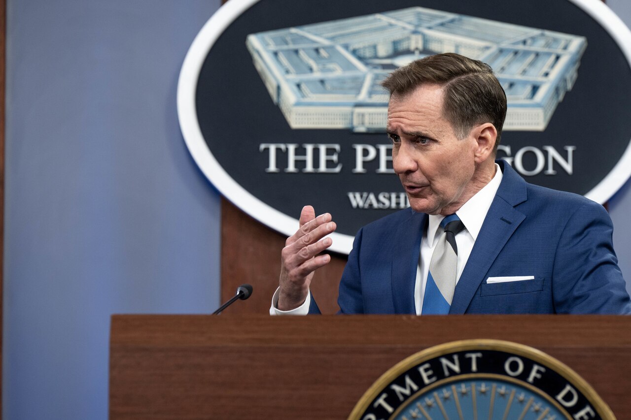 A man speaks from a podium.