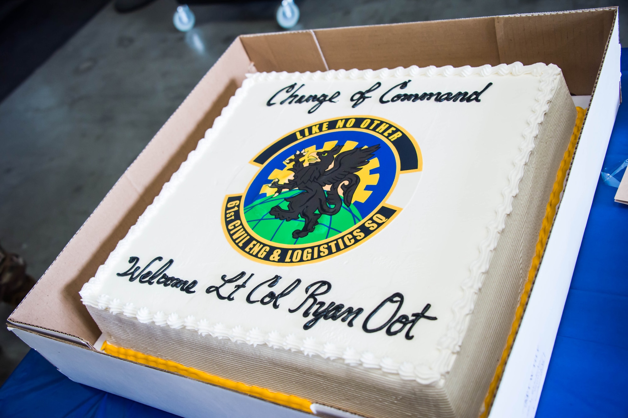 The ceremonial change of command cake welcomes the new 61st CELS commander Lt. Col. Ryan Oot to the unit at his change of command ceremony which was held in their warehouse on Monday