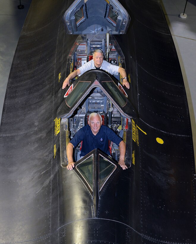 Image of two men in an aircraft.