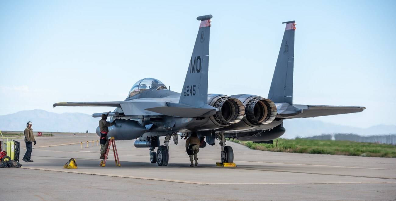 Maintenance professionals from Mountain Home Air Force Base, Idaho, prepare F-15E Strike Eagles