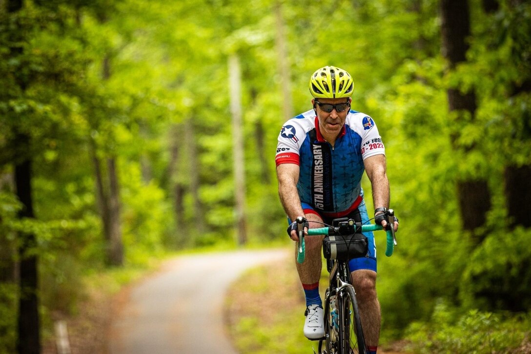 Chief Master Sgt. Jeremy Murphy, 363rd Intelligence, Surveillance, and Reconnaissance Group senior enlisted leader, rides his bike