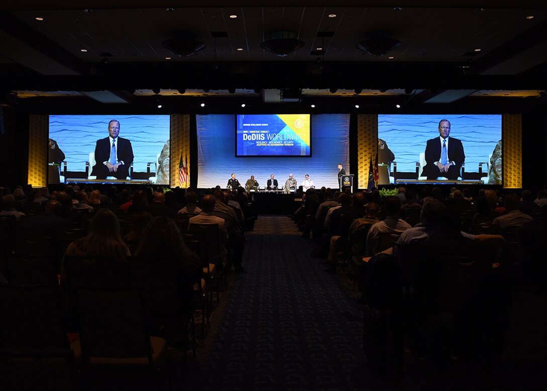 Image of the DoDIIS Worldwide conference room filled with people.