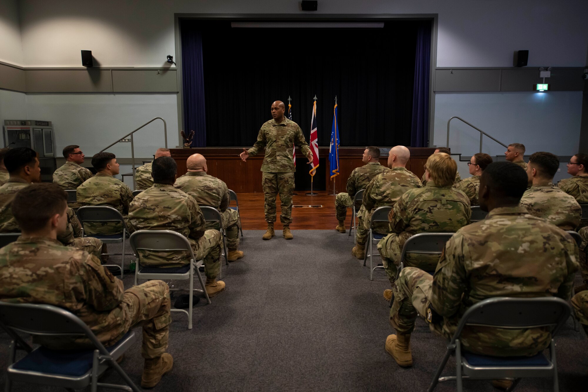 U.S. Air Force Brig. Gen. Roy W. Collins, center, Headquarters U.S. Air Force director of security forces and deputy chief of staff for logistics, engineering and force protection, speaks with 422nd Security Forces Squadron defenders during a visit to Royal Air Force Croughton, England, May 23, 2022. Collins and Chief Master Sgt. Donald S. Gallagher, 20th Security Forces career field manager, visited RAF Croughton to present the 2021 Air Force Best Small Security Forces Squadron to the 422nd SFS. (U.S. Air Force photo by Senior Airman Jennifer Zima)