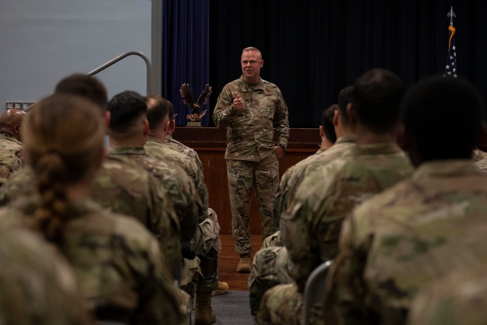 U.S. Air Force Chief Master Sgt. Donald S. Gallagher, center, 20th Security Forces career field manager, speaks with 422nd Security Forces Squadron defenders during a visit to Royal Air Force Croughton, England, May 23, 2022. Gallagher and Brig. Gen. Roy W. Collins, Headquarters U.S. Air Force director of security forces and deputy chief of staff for logistics, engineering and force protection, visited RAF Croughton to present the 2021 Air Force Best Small Security Forces Squadron to the 422nd Security Forces Squadron. (U.S. Air Force photo by Senior Airman Jennifer Zima)