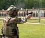 An Airman from the Pennsylvania National Guard's M9 pistol ejects an empty brass before loading the next round during the pistol portion of the Governor's Twenty competition on May 21, 2022. Airmen and Soldiers were challenged with pistol and rifle accuracy challenges.