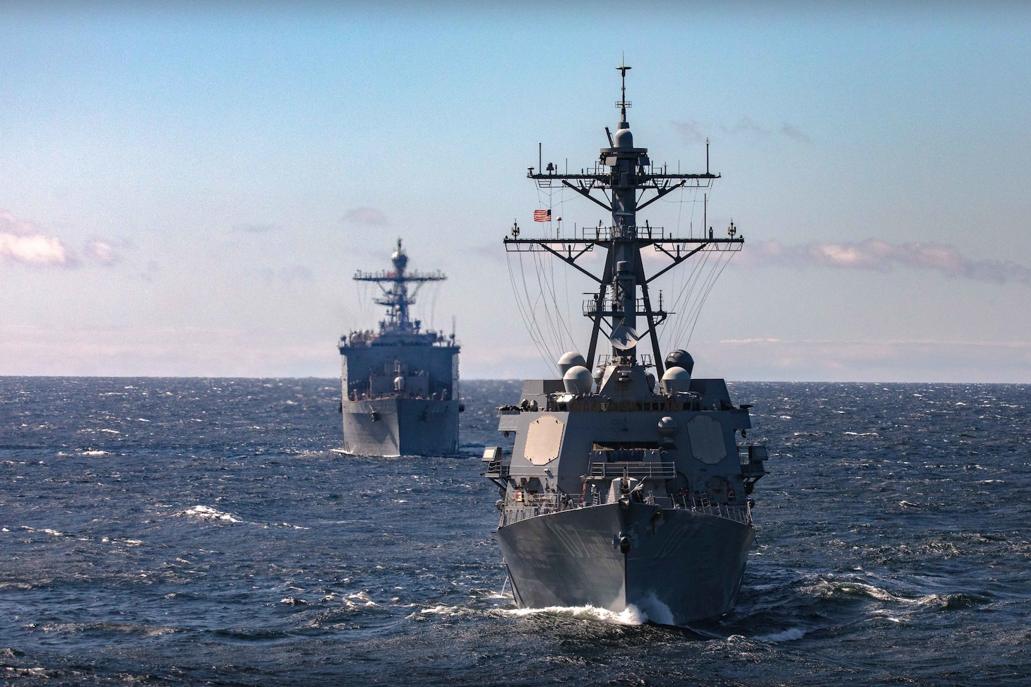 The Arleigh Burke-class guided-missile destroyer USS Gravely (DDG 107) sails in formation behind the wasp-class amphibious assault ship USS Kearsarge (LHD 3) during a maneuvering exercise with the Finnish and Swedish navies in the Baltic Sea, May 17, 2022.