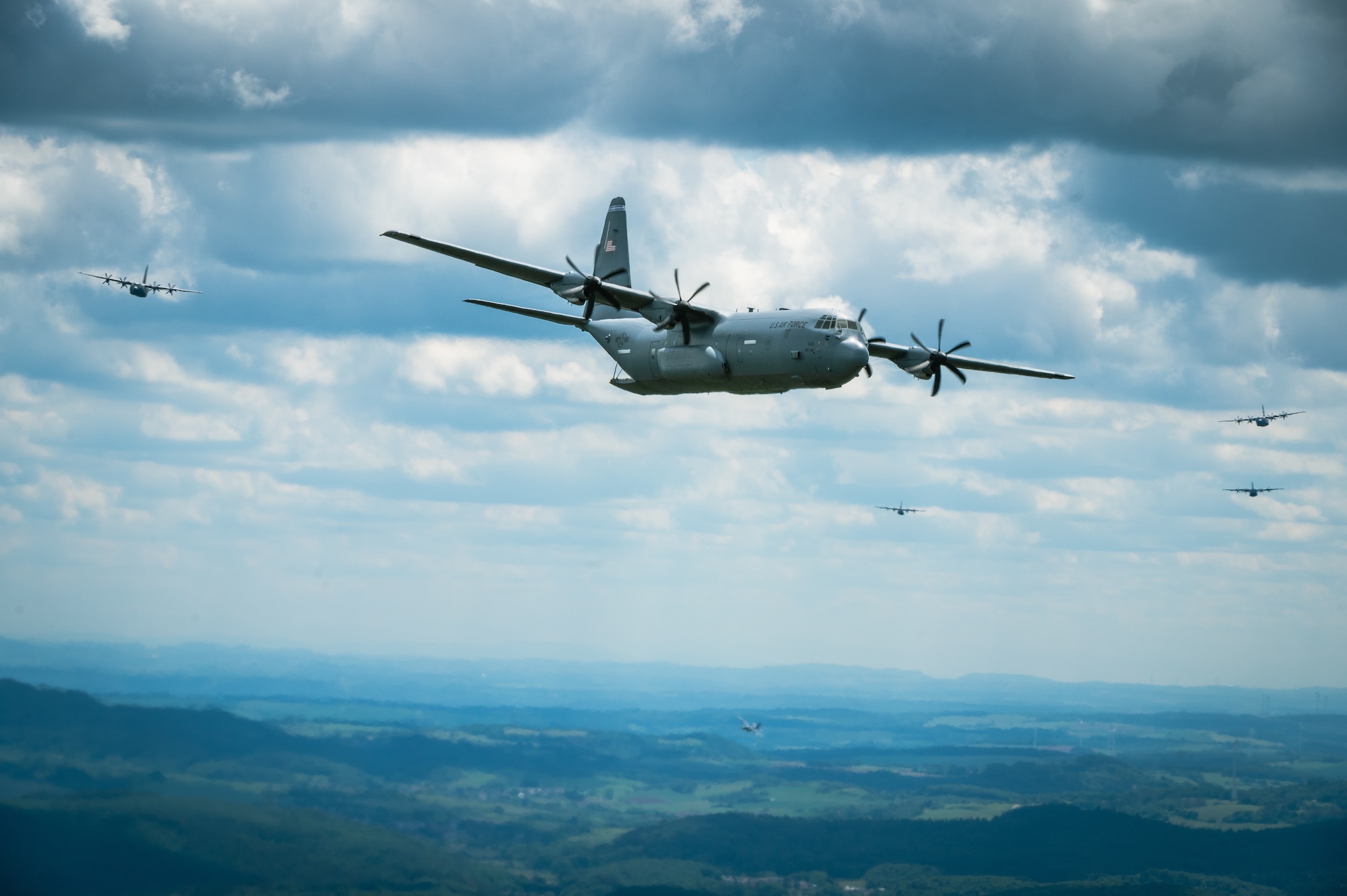 Multiple C-130J Super Hercules fly in formation