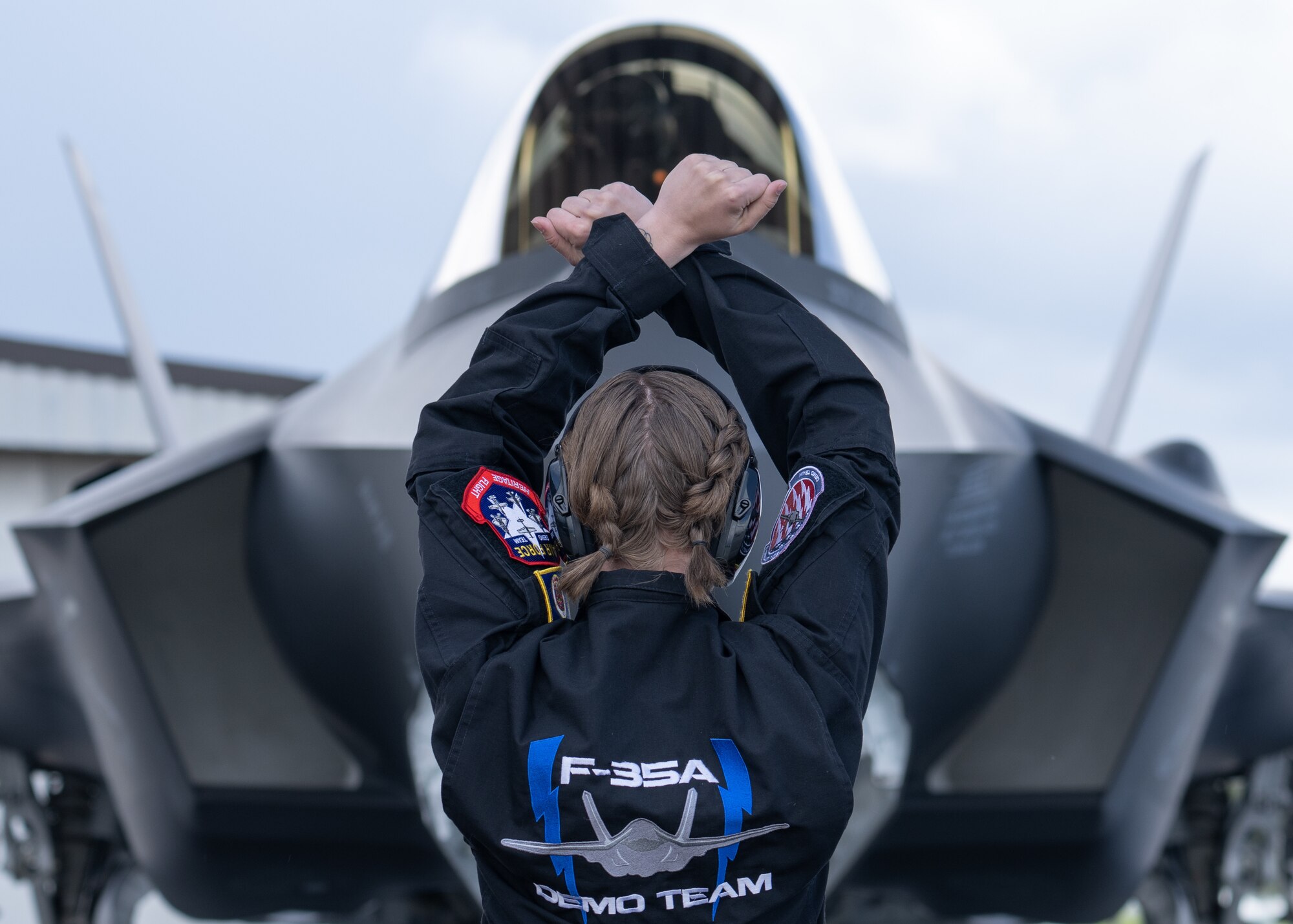 Senior Airman Jessica Pieper, F-35A Lightning II Demonstration Team dedicated crew chief, catches an F-35A