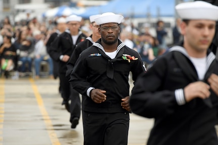Crewmembers attached to the Virginia-class fast attack submarine USS Oregon (SSN 793) run aboard to “bring the ship to life” during a commissioning ceremony in Groton, Conn., May 28, 2022.