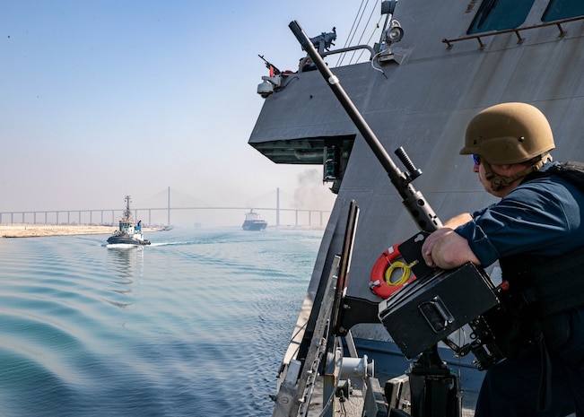 SUEZ CANAL, Egypt (May 29, 2022) Fire Control-man 1st class Christopher Massengill assigned to Littoral combat ship USS Sioux City (LCS 11) mans a M2A1 50. caliber machine gun as the Sioux City transits the Suez Canal, Egypt, May 29. Sioux City is deployed to the U.S. 5th Fleet area of operations to help ensure maritime security and stability in the Middle East region.