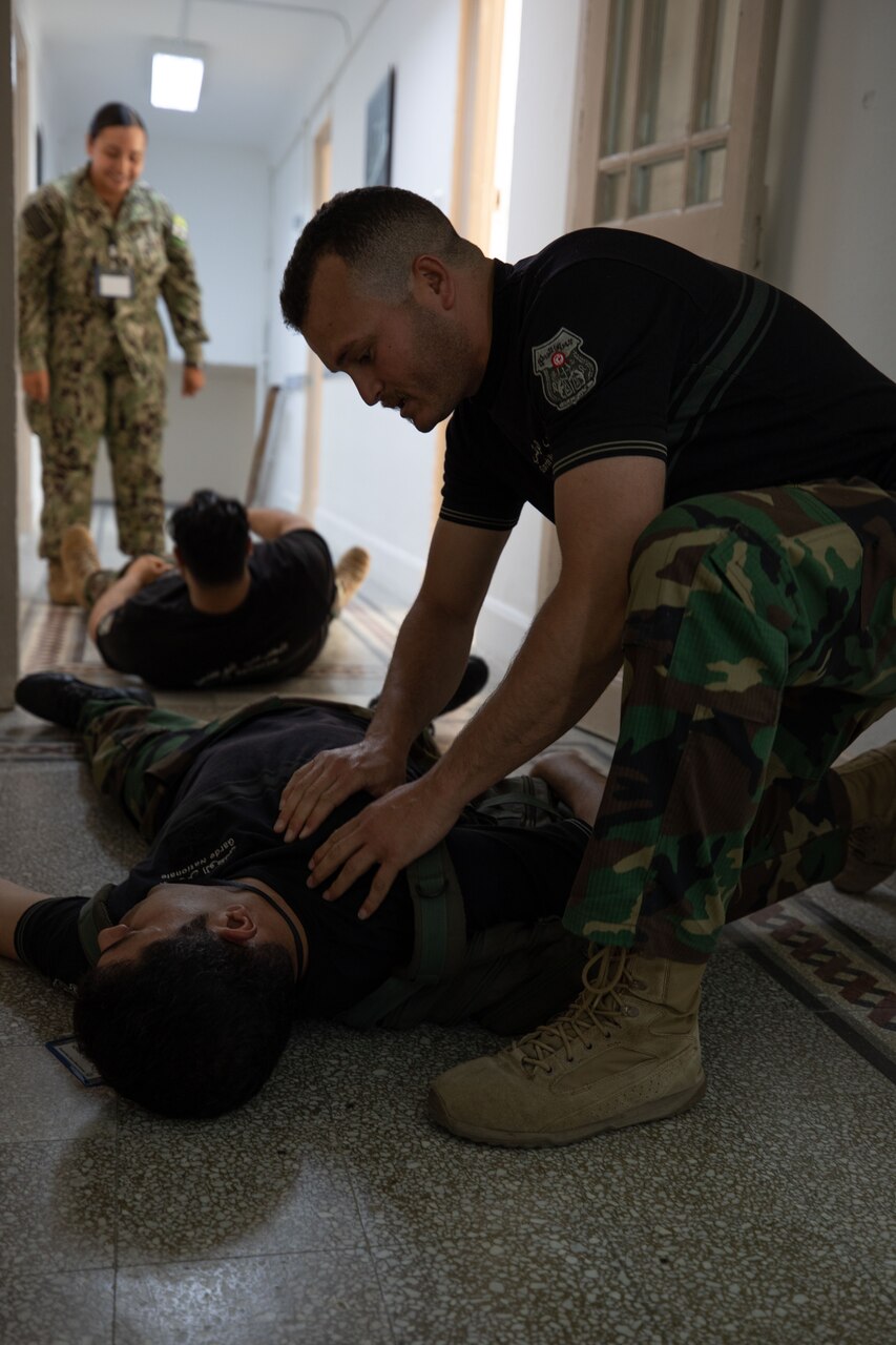 U.S. Marines, assigned to Task Force 61 Naval Amphibious Forces Europe/ 2d Marine Division (TF-61/2), and members of the Tunisian 51st Regiment Commando Maritime practice hoisting drills on the Tunisian NRF Khaireddine (A 700) during exercise Phoenix Express 2022 in Bizerte, Tunisia, May 24, 2022.