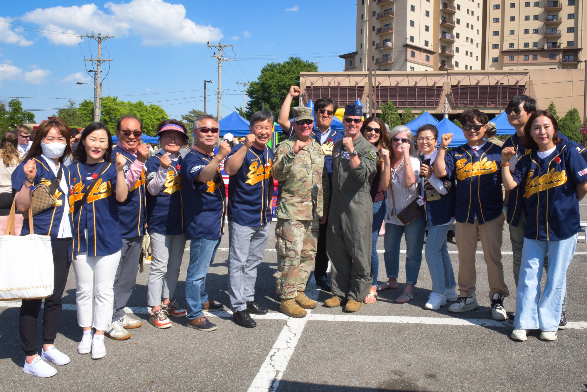 Leadership from the 51st Fighter Wing pose for a photo with Osan’s Good Neighbor members during the Memorial Day Bash at Osan Air Base, Republic of Korea, May 26, 2022.