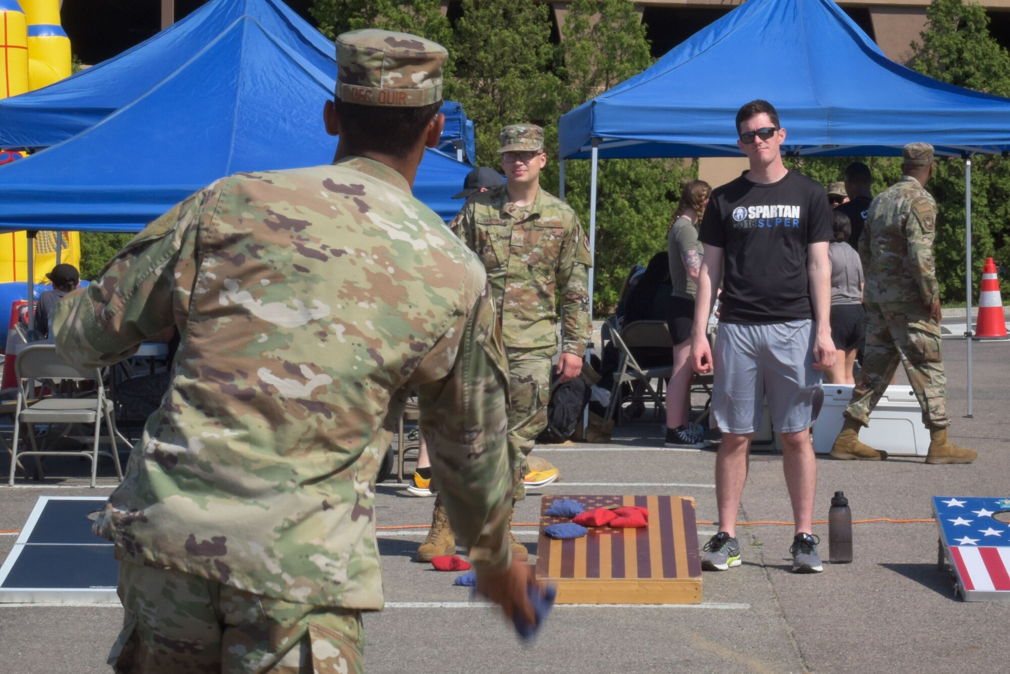 Airmen partake in outdoor festivities during the Memorial Day Bash at Osan Air Base, Republic of Korea, May 26, 2022.