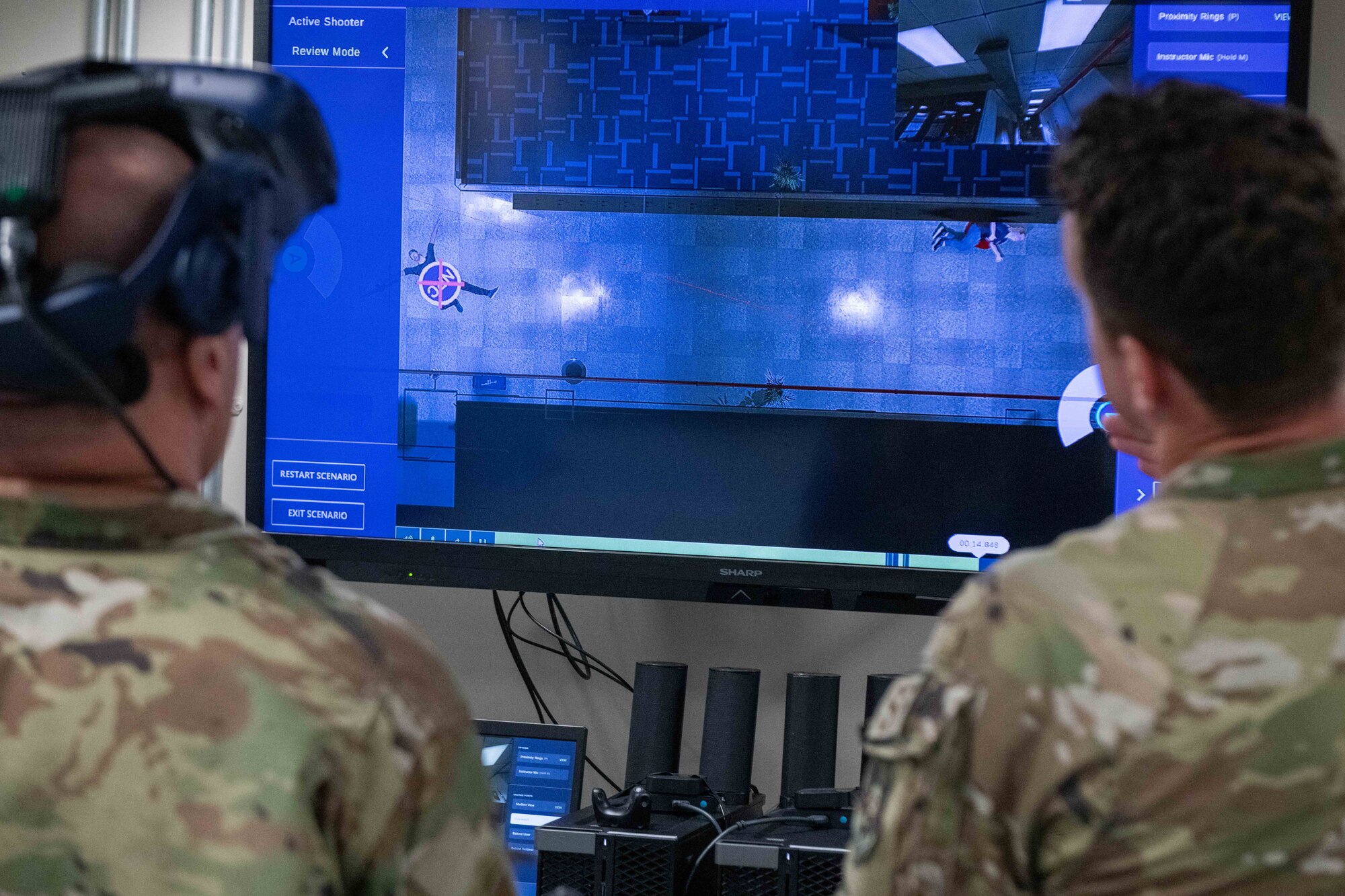 U.S. Air Force Tech Sgt. Jesse Ermer, a 379th Air Expeditionary Security Forces Squadron member, shows U.S. Air Force Brig. Gen. Gerald Donohue, 379th Air Expeditionary Wing Commander, a simulated active shooter scenario on Al Udeid Air Base, Qatar, May 24, 2022. The VR simulator enables first responders to practice for situations they may have to encounter in the real world. (U.S. Air National Guard photo by Airman 1st Class Constantine Bambakidis)