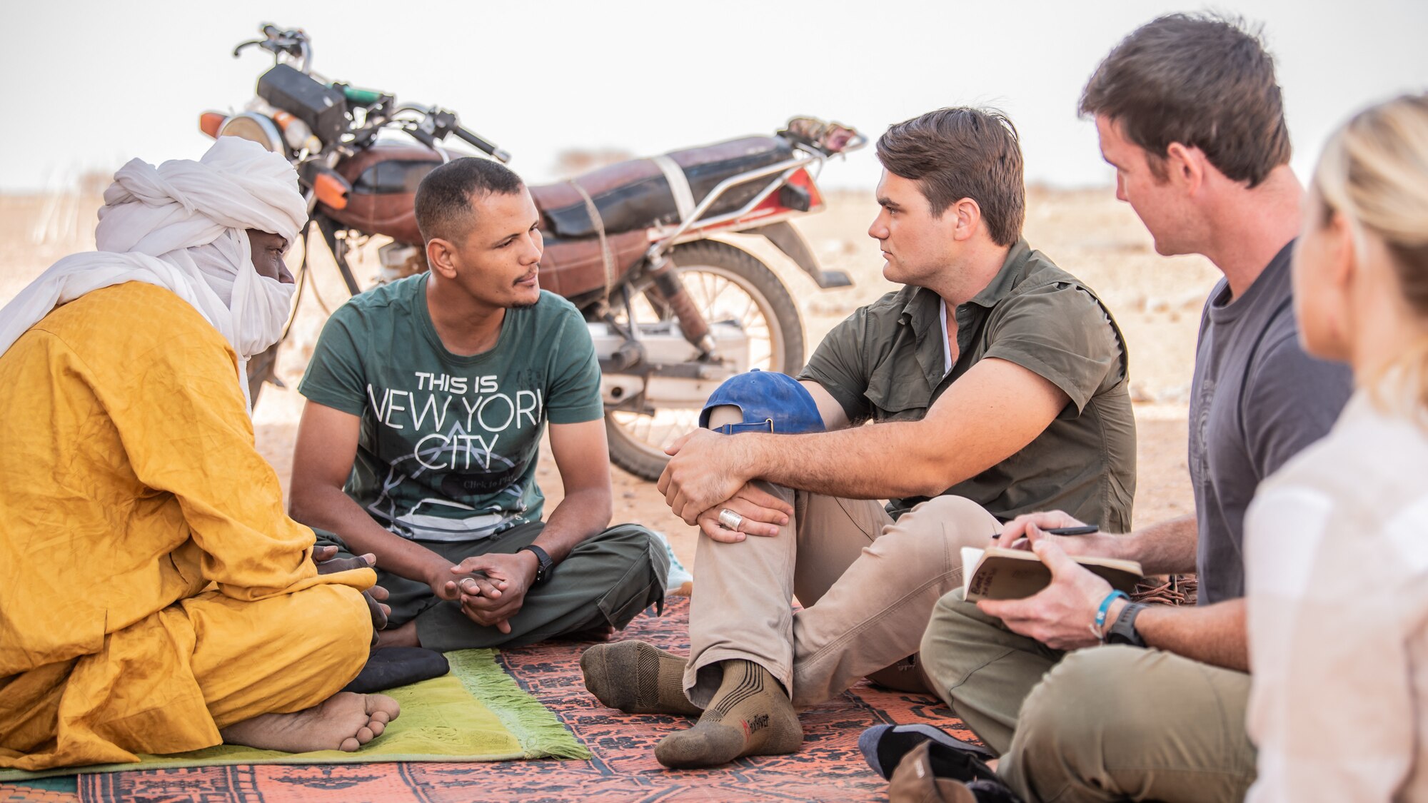 U.S. service members and a translator meet with the village chief at Attimick, Niger