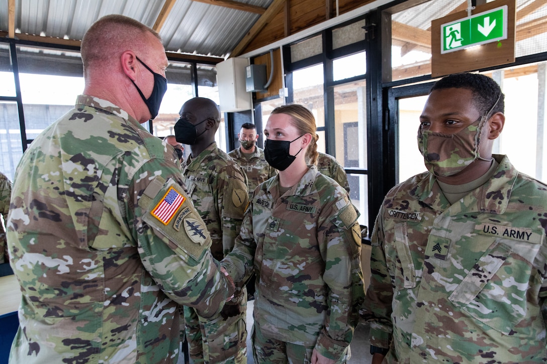 Kentucky National Guard Brig. Gen. Rob Larkin meets with Staff Sgt. Hannah Barton and Sgt. Andreus Crittenden while they support Operation Tradewinds 22 at Price Barracks, Belize on May 18, 2022. 75th Troop Command supported Tradewinds 22 by providing brigade level support to over 1800 servicemembers from 22 countries (U.S. Army photo by Staff Sgt. Andrew Dickson).