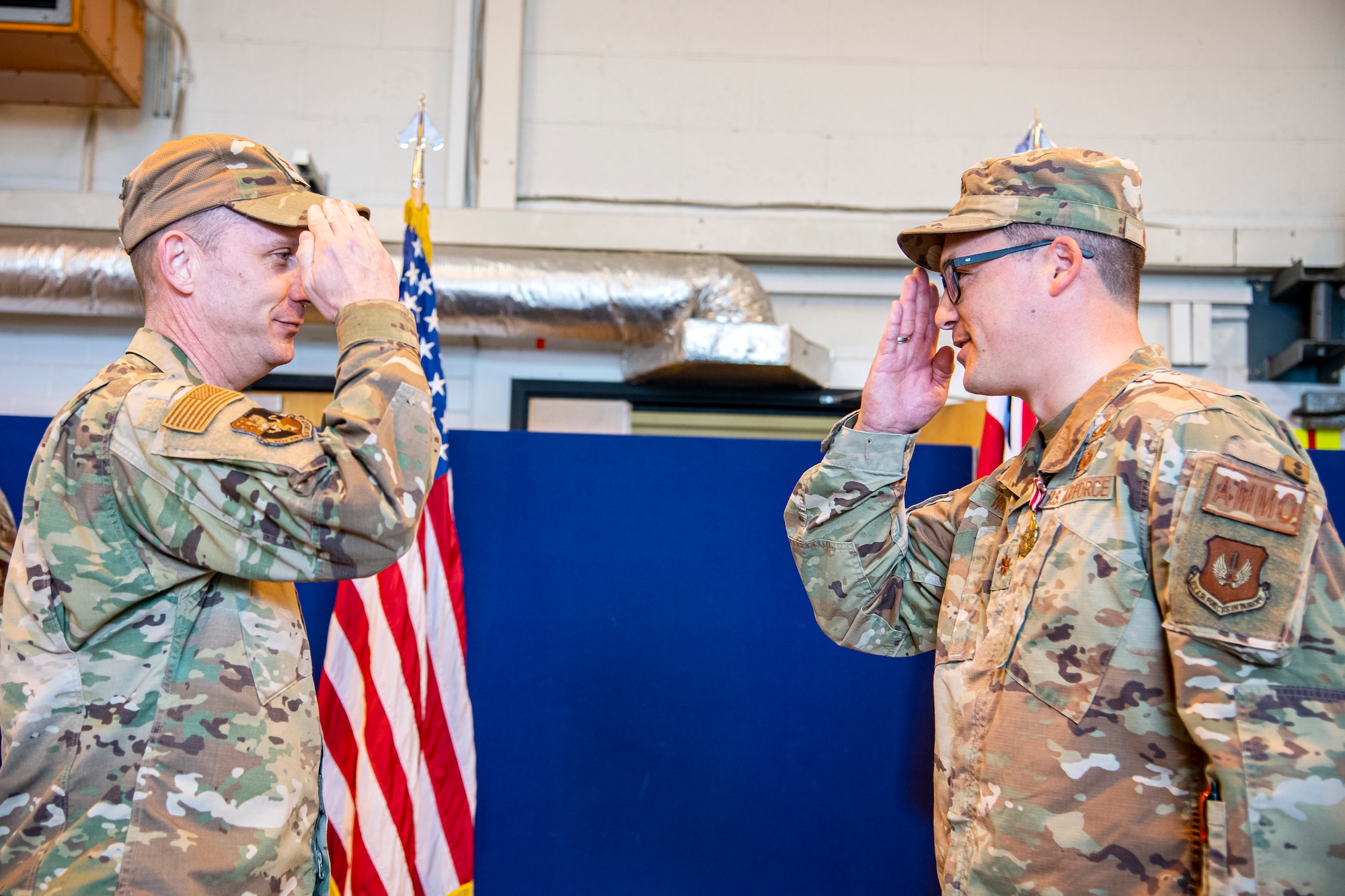 U.S. Air Force Maj. Christopher Wood, right, 420th Munitions Squadron outgoing commander, salutes Col. Jon T. Hannah, 422d Air Base Group commander, during a change of command ceremony at RAF Welford, England, May 26, 2022. During his command Wood was responsible for all munitions operations maintaining USAFE’s second largest weapons stockpile valued at $403 million in war reserve material. (U.S. Air Force photo by Staff Sgt. Eugene Oliver)