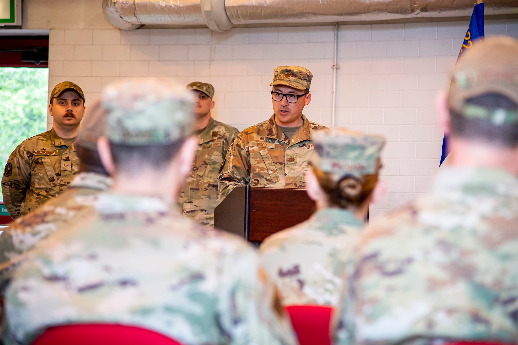 U.S. Air Force Maj. Christopher Wood, 420th Munitions Squadron outgoing commander, speaks during a change of command ceremony at RAF Welford, England, May 26, 2022. During the ceremony, Wood relinquished command of the 420th MUNS to Maj. Preston Smith. (U.S. Air Force photo by Staff Sgt. Eugene Oliver)