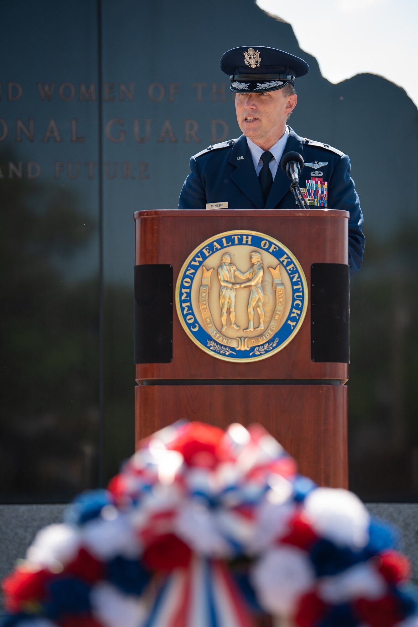 Air Force Brig. Gen. Jeffrey L. Wilkinson, the Kentucky National Guard’s assistant adjutant general for Air, speaks to the audience at a memorial service held in Frankfort, Ky., May 30, 2022, honoring members of the Kentucky Guard who have died in the line of duty. The names of 13 Soldiers were added to the Kentucky National Guard Memorial at Boone National Guard Center this year, bringing the total number of fallen Airmen and Soldiers to 286. This year also marks the 30th anniversary of a C-130 Hercules plane crash in Evansville, Ind., that claimed the lives of five aircrew members from the Kentucky Air National Guard’s 123rd Airlift Wing. (U.S. Air National Guard photo by Dale Greer)