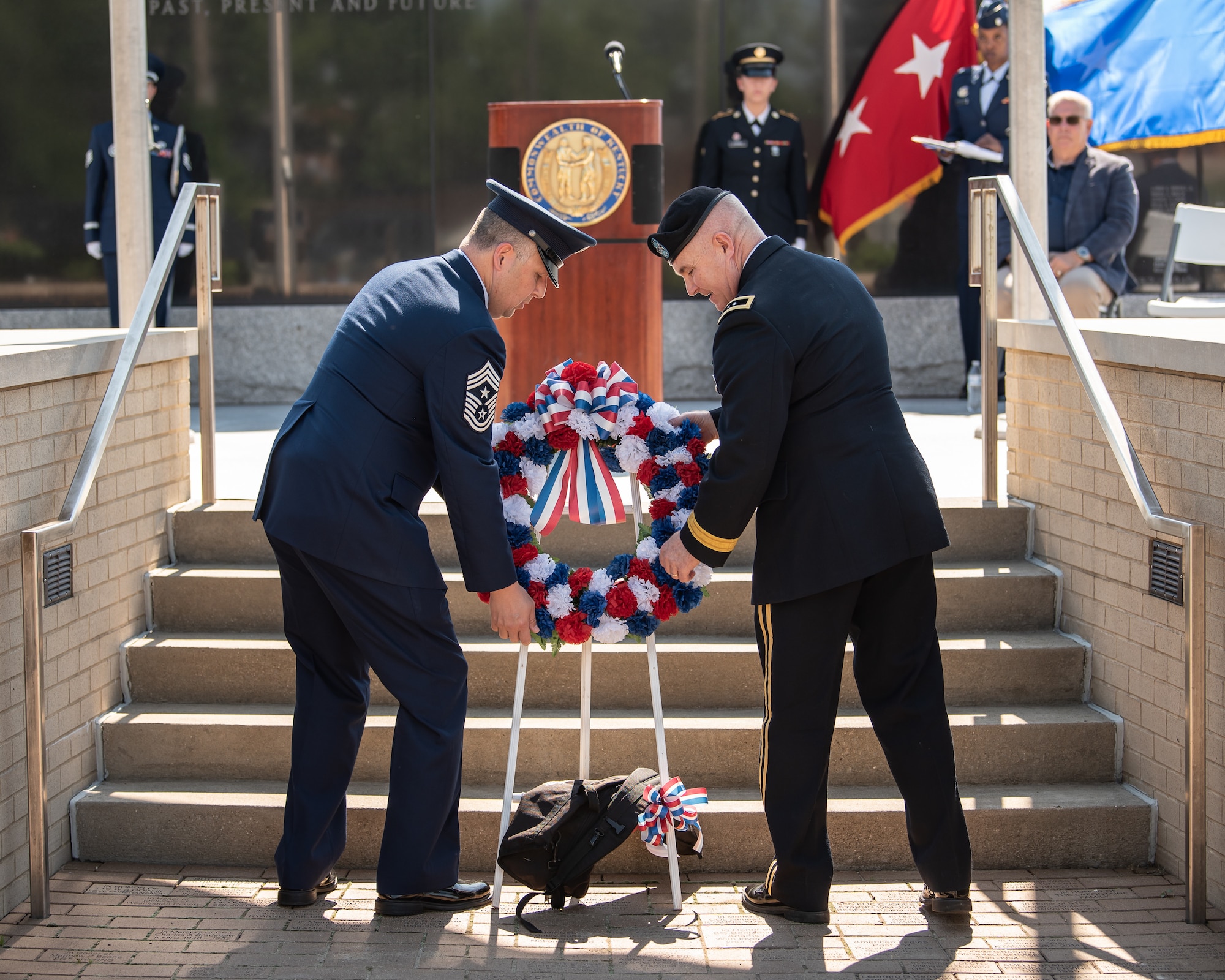 Air Force Chief Master Sgt. James R. Tongate, left, Kentucky Air National Guard state command chief; and Army Maj. Gen. Haldane B. Lamberton, the adjutant general of the Commonwealth of Kentucky, place a wreath at the Kentucky National Guard Memorial during a ceremony in Frankfort, Ky., May 30, 2022. The memorial honors 286 Soldiers and Airmen from the Kentucky Guard who have paid the ultimate price for freedom since 1912. (U.S. Air National Guard photo by Dale Greer)