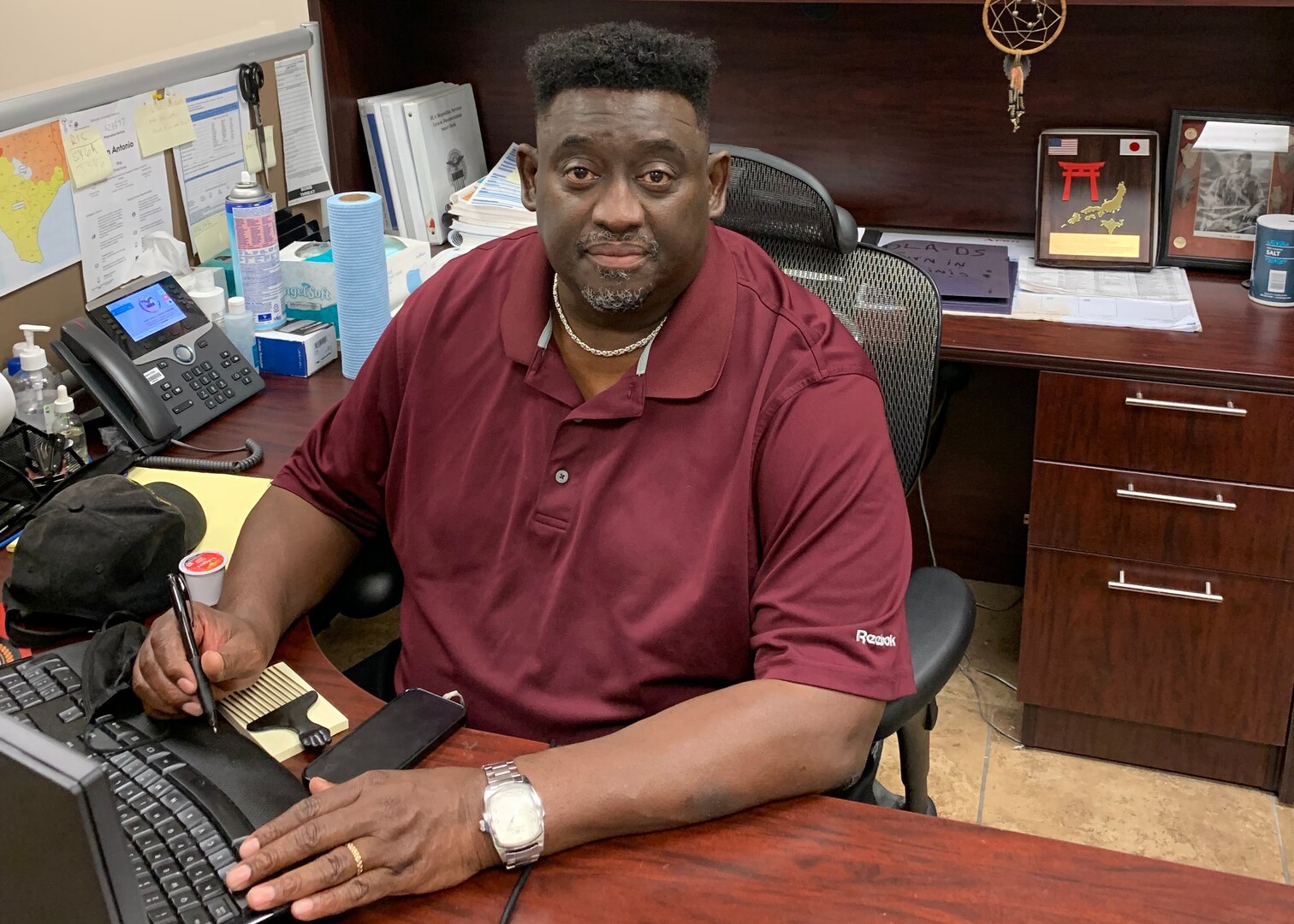 Dan Daniels, disposition services representative at
DLA Disposition Services San Antonio, Texas. Sits at his desk.