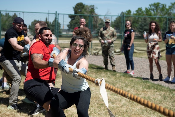 Members of the 460th Civil Engineer Squadron participate in a game of tug-of-war May 26, 2022, at Buckley Space Force Base, Colo.