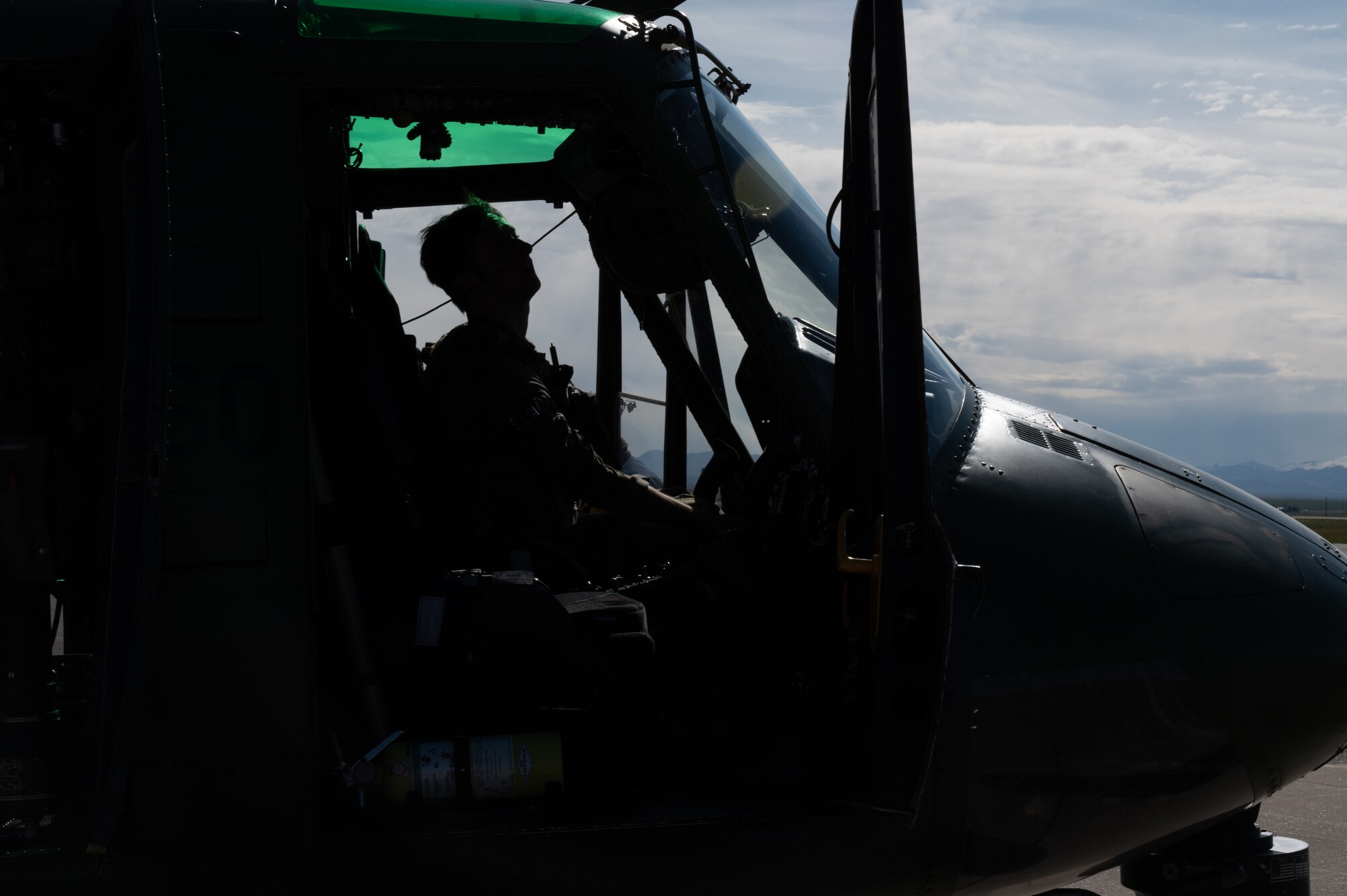 Capt. Scott Rumsey, 40th Helicopter Squadron pilot, performs preflight checks of a UH-1N Huey helicopter May 24, 2022, at Malmstrom Air Force Base, Mont.