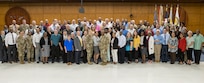 U.S. Army Financial Management Command leadership and USAFMCOM Military Pay Operations employees pose for a photo during an Army Military Pay Office leadership forum at the Maj. Gen. Emmett J. Bean Federal Center in Indianapolis May 12, 2022. Throughout the three-day forum, subject matter experts from USAFMCOM, the Defense Finance and Accounting Service, and other U.S. Army organizations covered a variety of topics including military pay operations, human resources, debt and claims, SmartVoucher for permanent change of station moves, fraud, ethics, and Army-specific functions. (U.S. Army photo by Mark R. W. Orders-Woempner)