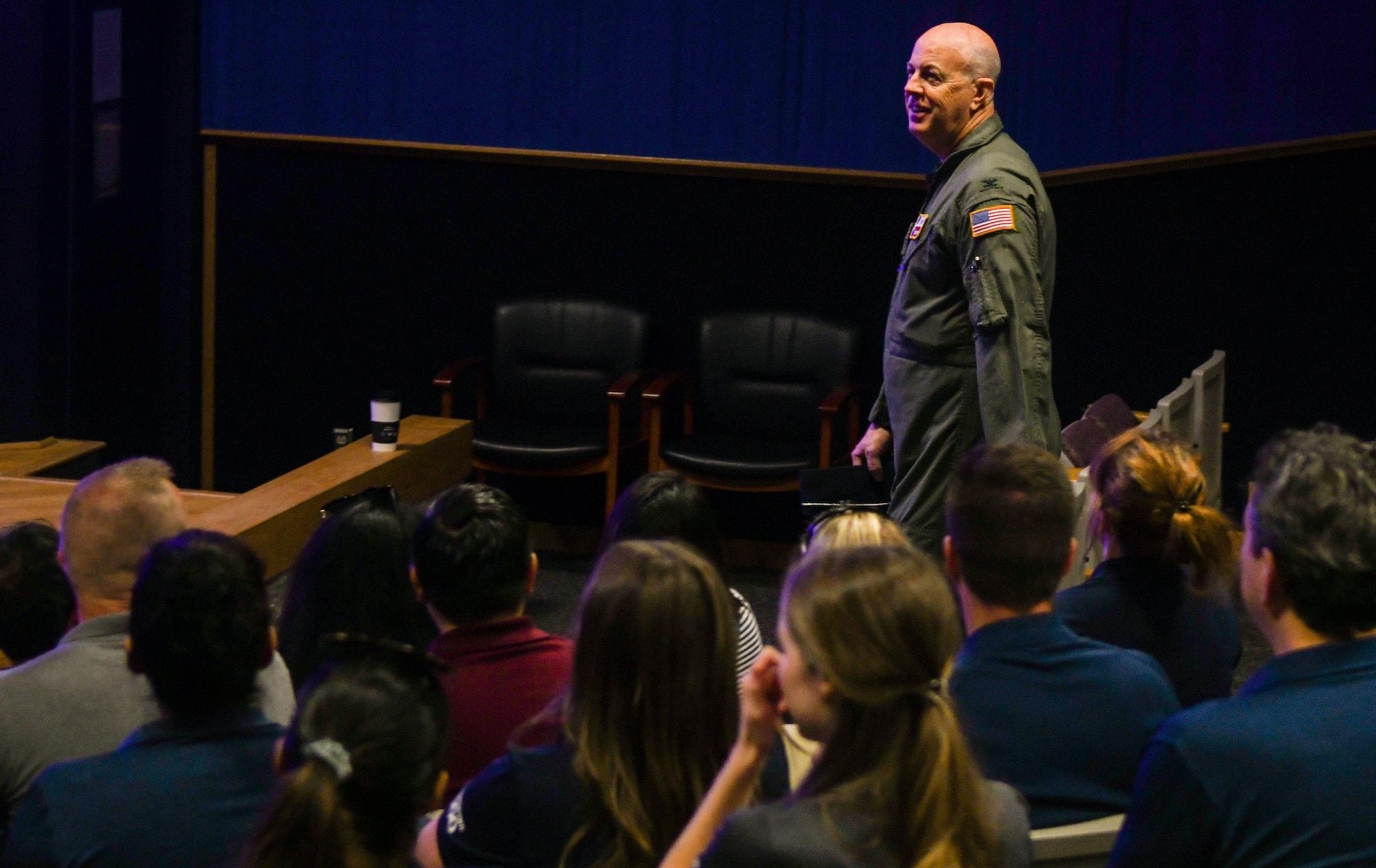 Col. James Miller, 433rd Operations Group commander, briefs USAA employees on the capabilities of the 433rd Airlift Wing and its aircraft at Joint Base San Antonio-Lackland, Texas, May 17, 2022. The USAA visit also included a tour of the C-5M Super Galaxy aircraft and a virtual reality training demonstration. (U.S. Air Force photo by Airman 1st Class Mark Colmenares)