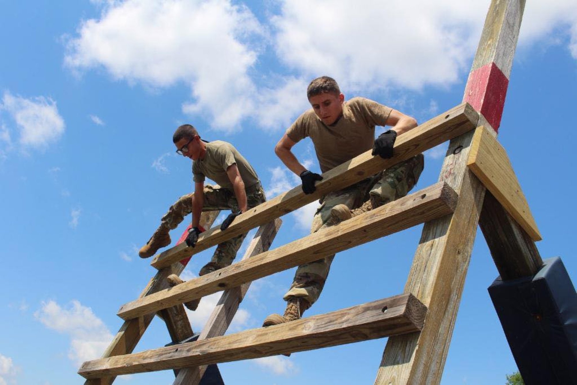Air Force ROTC cadets take part in an obstacle course in May 2022, on Maxwell Air Force Base, Alabama. This is the first time since 2019 that field training will be conducted at normal capacity on Maxwell throughout the summer, marking a departure from modified operations as the COVID-19 pandemic abates.